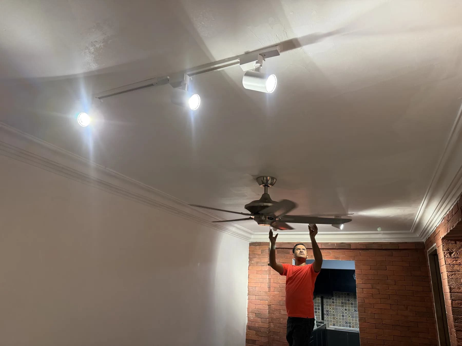 Track lighting and ceiling fan installation in progress