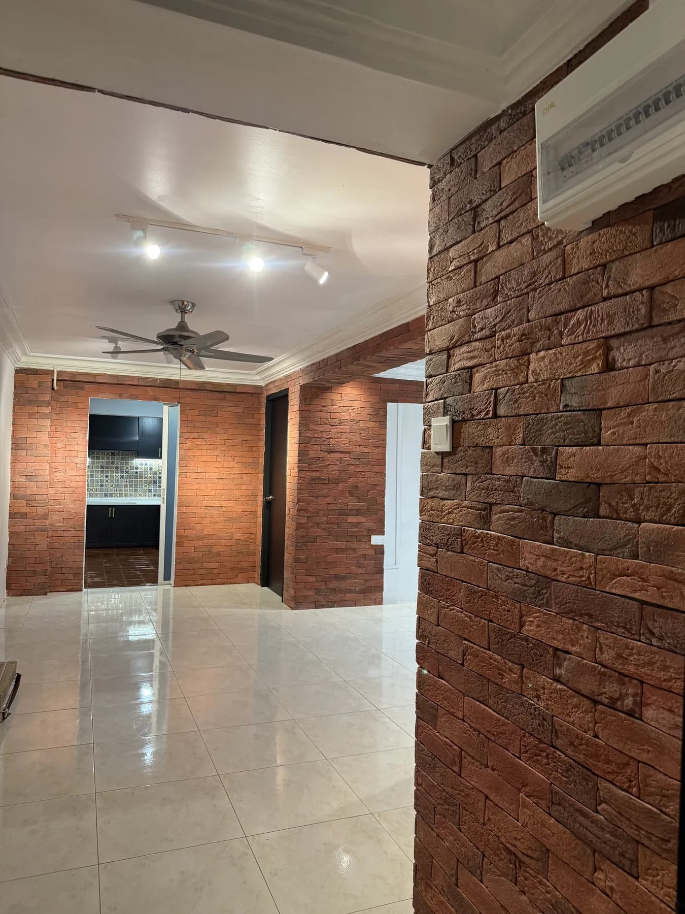 Completed living room with brick-style feature finishes