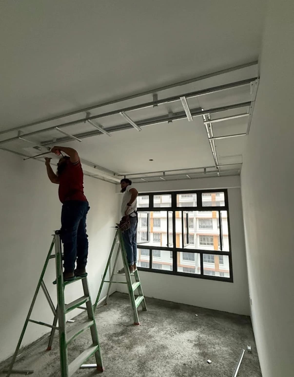 Ceiling framing installation in progress during the Bartley BTO renovation